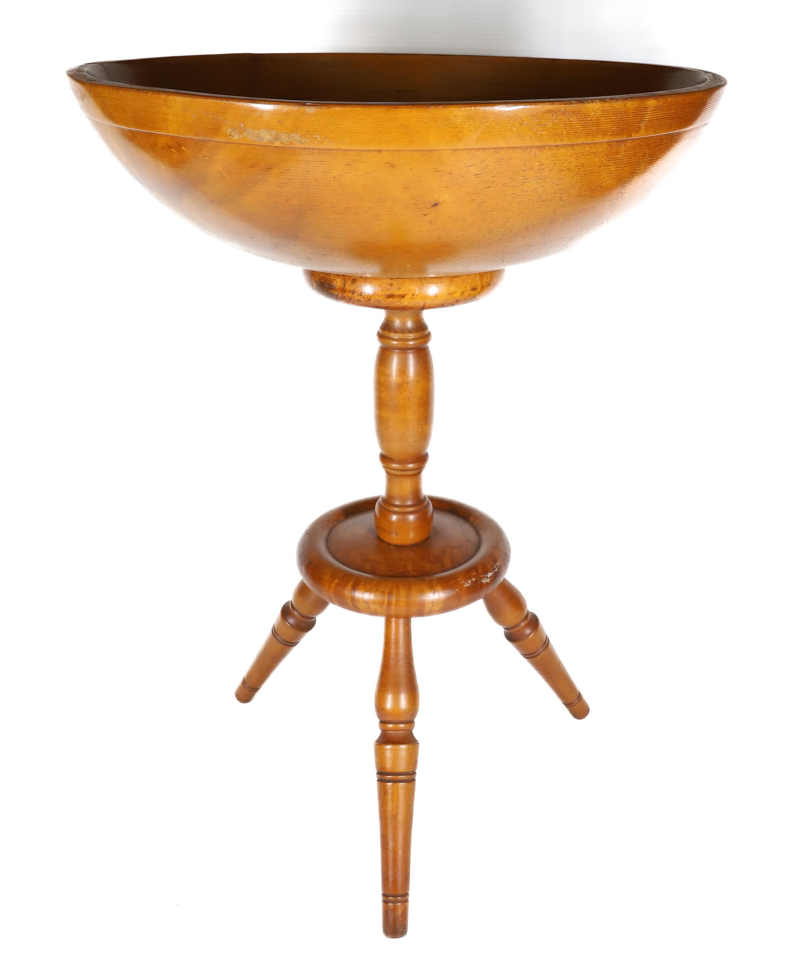 WOOD BOWL ON BASE: TURNED WOODEN BOWL ON REVOLVING TRIPOD BASE. 23 1/2" X 17" X 16 1/2". PLEASE READ CAREFULLY â€“ THIS IS AN IN-PERSON & ON-LINE AUCTION. SALE IS LOCATED IN HARMONY TOWNSHIP, PHILLIPSBU