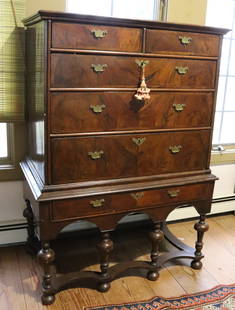 WILLIAM AND MARY CHEST ON STAND: TWO DRAWERS OVER THREE DRAWERS ON STAND WITH ONE DRAWER. VENEERED SURFACE. BRASS HARDWARE, DOVETAILED CONSTRUCTION. 56" X 39" X 22 1/2" PLEASE READ CAREFULLY &#226;&#8364;&#8220; THIS IS AN IN-PERSON