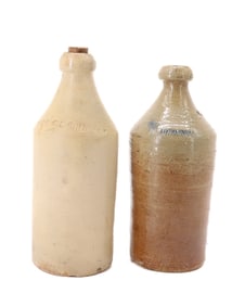 (2) STONEWARE ADVERTISING BOTTLES