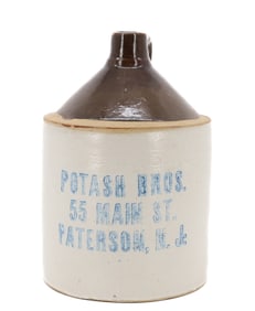 STONEWARE STENCILED ADVERTISING JUG, PATERSON, NJ