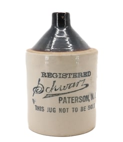 STONEWARE STENCILED ADVERTISING JUG, PATERSON, NJ