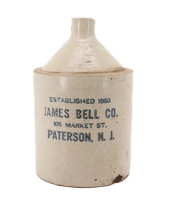 STONEWARE STENCILED ADVERTISING JUG, PATERSON, NJ