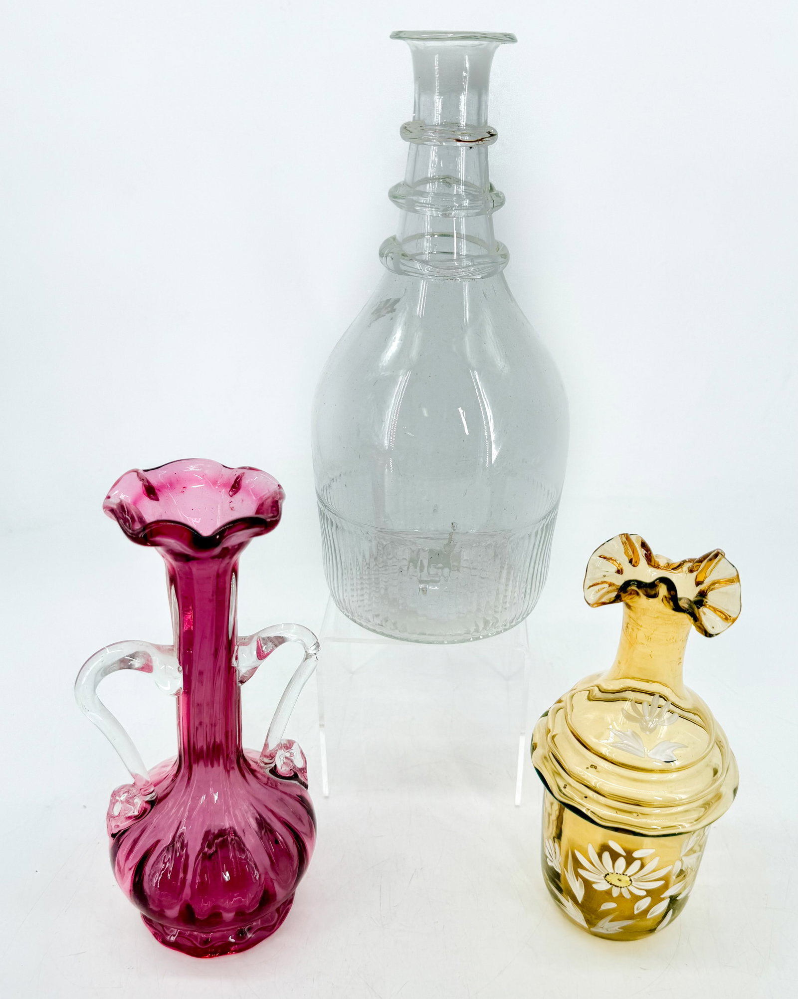 LOT OF ANTIQUE GLASS: INCLUDING: BLOWN GLASS DECANTER WITH APPLIED BANDS 9 3/4" H., CRANBERRY VASE WITH APPLIED HANDLES, HAND PAINTED AMBER DECANTER 7 1/4". PLEASE READ CAREFULLY - Terms for Purchasing and Shipping of Auct