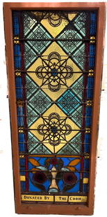 STAINED GLASS LEADED CHURCH WINDOW: MULTI-COLOR DECORATED GLASS. "DONATED BY THE CHOIR" WOODEN FRAMEWORK. 66 1/2" X 28". PLEASE READ CAREFULLY - Terms for Purchasing and Shipping of Auction Items. Please read carefully before bidding. H