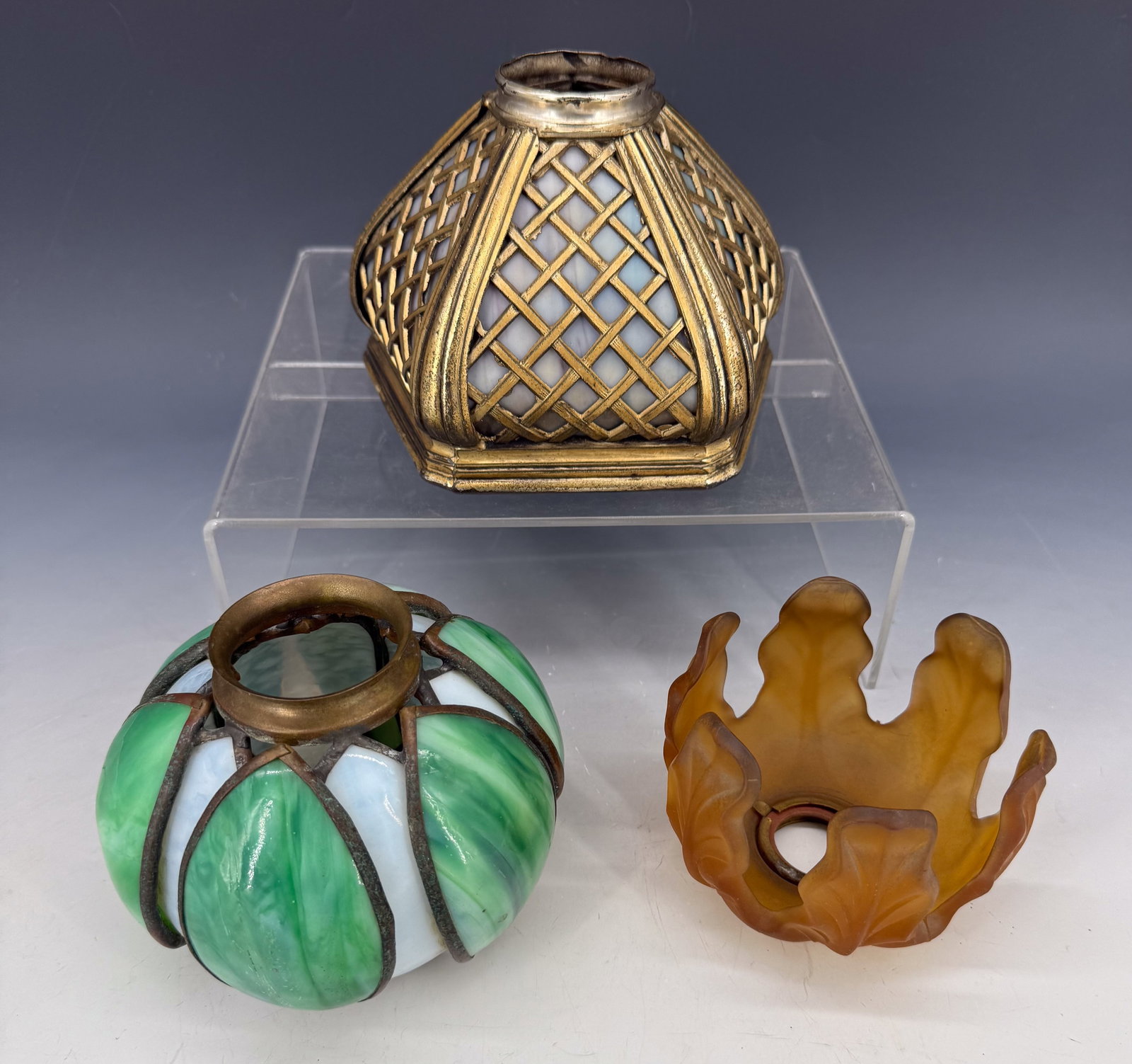 (3) VINTAGE GLASS SHADES: FROSTED AMBER LEAF PATTERN 4" D., GREEN/WHITE SLAG GLASS LEAF DESIGN 5 1/2" D. AND HEAVY METAL/SLAG GLASS FIVE-SIDED SHADE 5" X 6 1/2". PLEASE READ CAREFULLY - Terms for Purchasing and Shipping of Auc