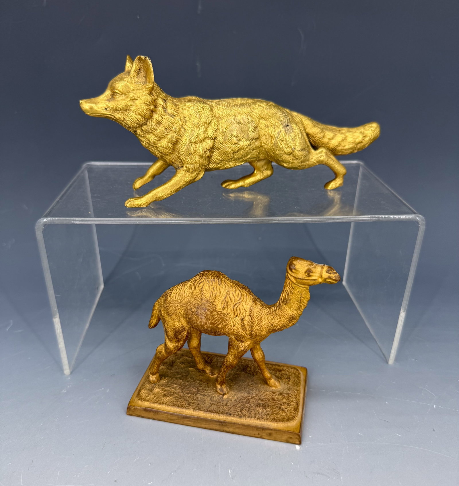 GILT BRONZE CAMEL AND FOX: BRONZE CAMEL SGND. FROST, 1899 ON BOTTOM 3 3/4" X 3 3/4". WITH, GILT METAL FOX 7" L. PLEASE READ CAREFULLY - Terms for Purchasing and Shipping of Auction Items. Please read carefully before bidding. H
