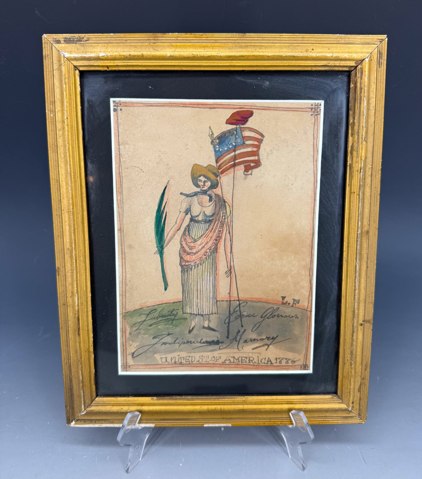 PATRIOTIC WATERCOLOR ON PAPER: WOMAN HOLDING FLAG WITH LIBERTY CAP. "UNITED ST. OF AMERICA 1776" AND "LIBERTY, INDEPENDENCE, EVER GLORIOUS MEMORY". MATTED AND FRAMED UNDER GLASS. INITIALED L.F. 11" X 8 3/4". SIGHT VIEW 7 3/4" X 5 1