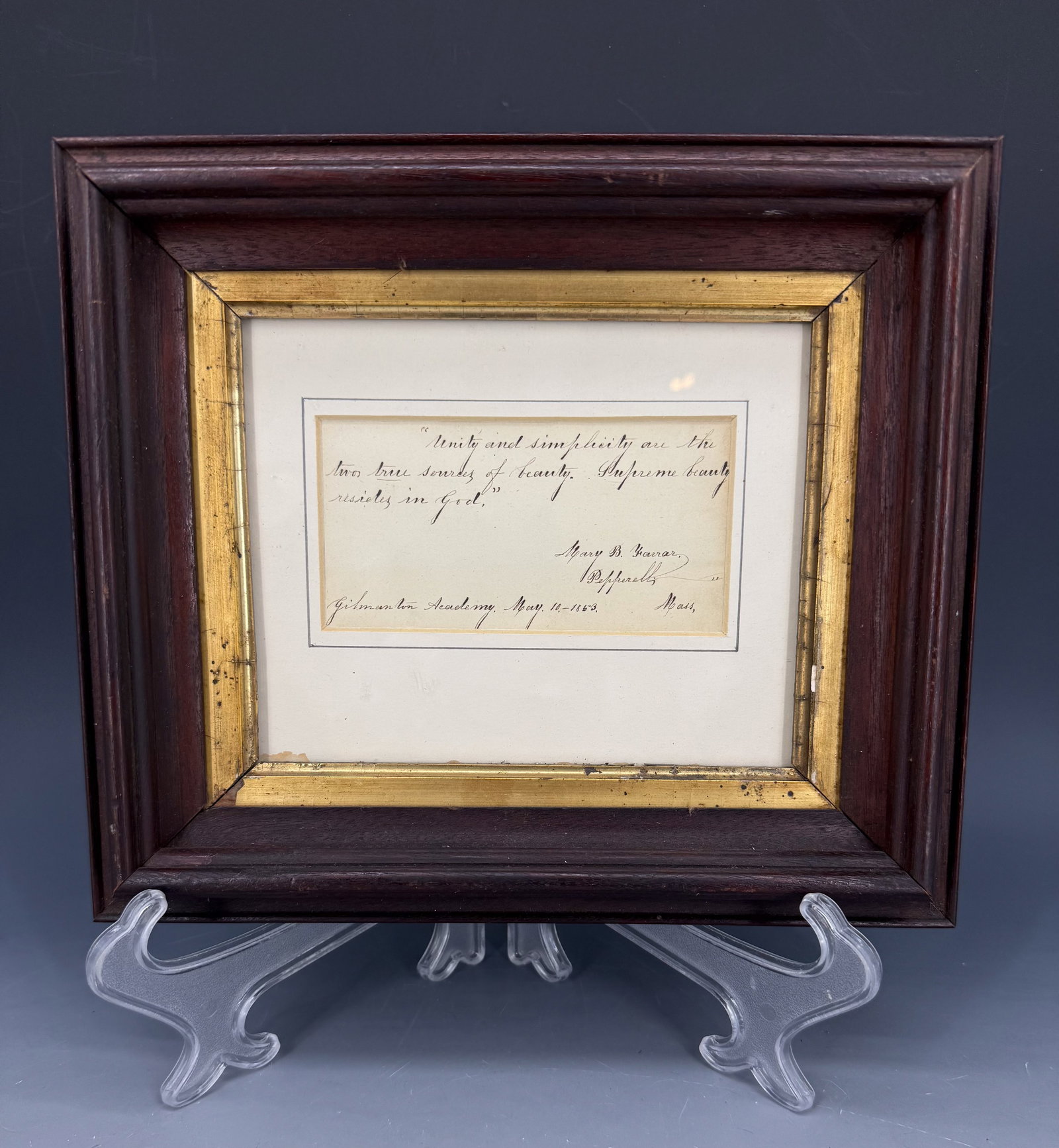19TH C. SCHOOLGIRL INK ON PAPER: UNITY AND SIMPLICITY ARE THE TWO TRUE SOURCES OF BEAUTY. SUPREME BEAUTY RESIDES IN GOD. MARY B. FARRAR, PEPPERELL, MASS, GILMANTON ACADEMY, MAY 10, 1863. MATTED AND FRAMED UNDER GLASS. TOTAL SIZE 9 1/