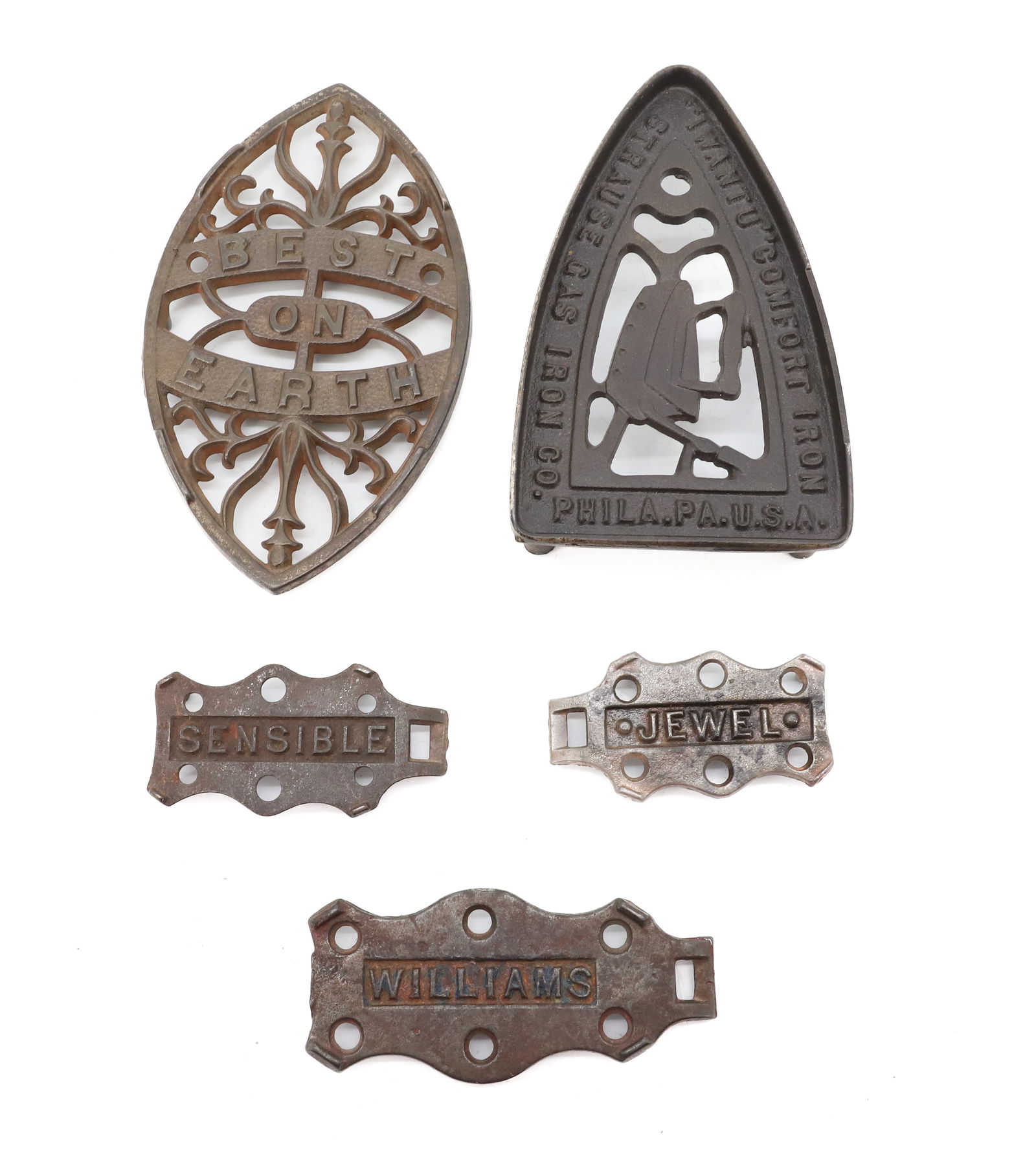 LOT OF ANTIQUE TRIVETS: (5) INCLUDING: BEST ON EARTH DOUBLE POINT, I WANT U COMFORT IRON, ONE MRKD. WILLIAMS, ONE MRKD. SENSIBLE AND ONE MRKD. JEWEL. 3 1/4" TO 8" LENGTHS. PLEASE READ CAREFULLY - Terms for Purchasing and Shi