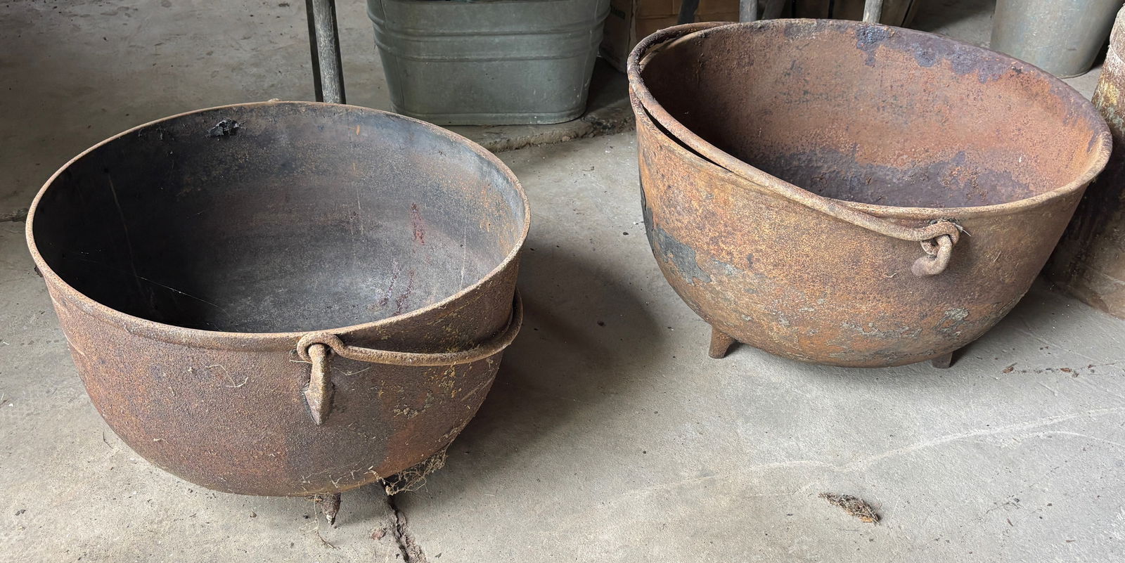 (2) BUTCHER KETTLES: WITH HANDLES, CAST IRON THIS IS AN ON-SITE ONLINE ONLY AUCTION. THIS SALE WILL BE PICK UP ONLY. THERE WILL BE ONE DAY FOR PICK-UP. ITEMS MUST BE PAID FOR BEFORE PICKING UP. IF YOU BUY LARGE SCRAP LOTS