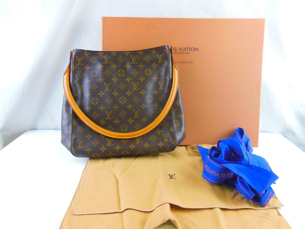 Louis Vuitton Purse in Original box: Dimensions: 13"x13" Authentic purse in original box with bag in excellent like new condition.