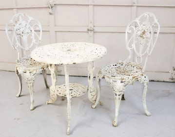 CAST IRON TABLE AND CHAIRS