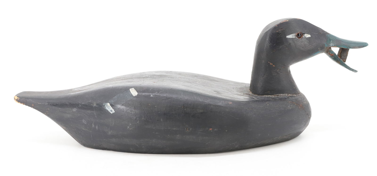 CARVED CANADIAN DECOY: CARVED WOOD WITH PAINTED SURFACE AND GLASS EYES. MRKD. ON BOTTOM "MADE IN CANADA". 17 1/2" L. PLEASE READ CAREFULLY - Terms for Purchasing and Shipping of Auction Items. Please read carefully before b