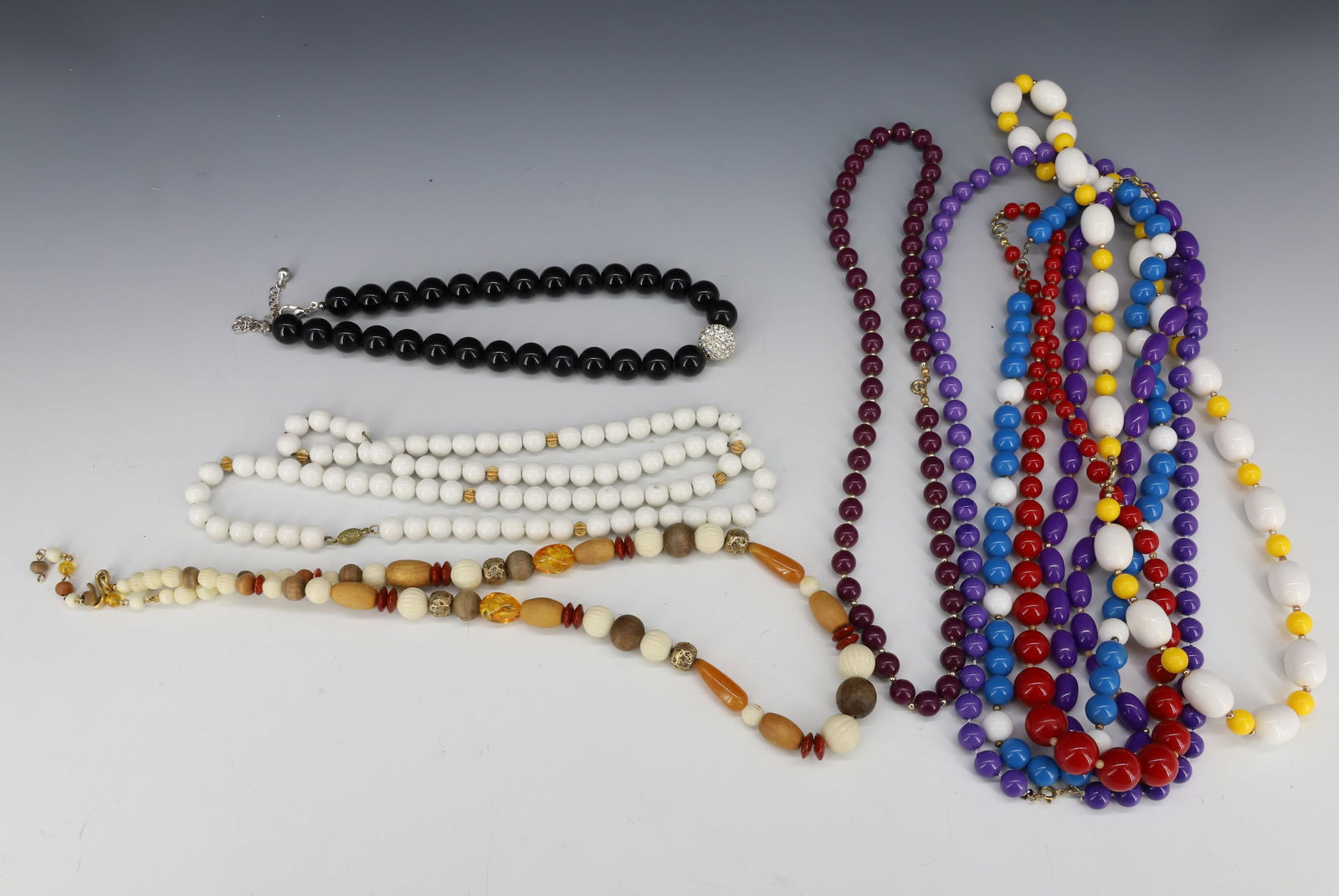 LOT OF BEADED NECKLACES: VARIETY OF COLORS. PLEASE READ CAREFULLY - Terms for Purchasing and Shipping of Auction Items. Please read carefully before bidding. Hartzell’s Auction Gallery. Hartzell's Auction Gallery will h