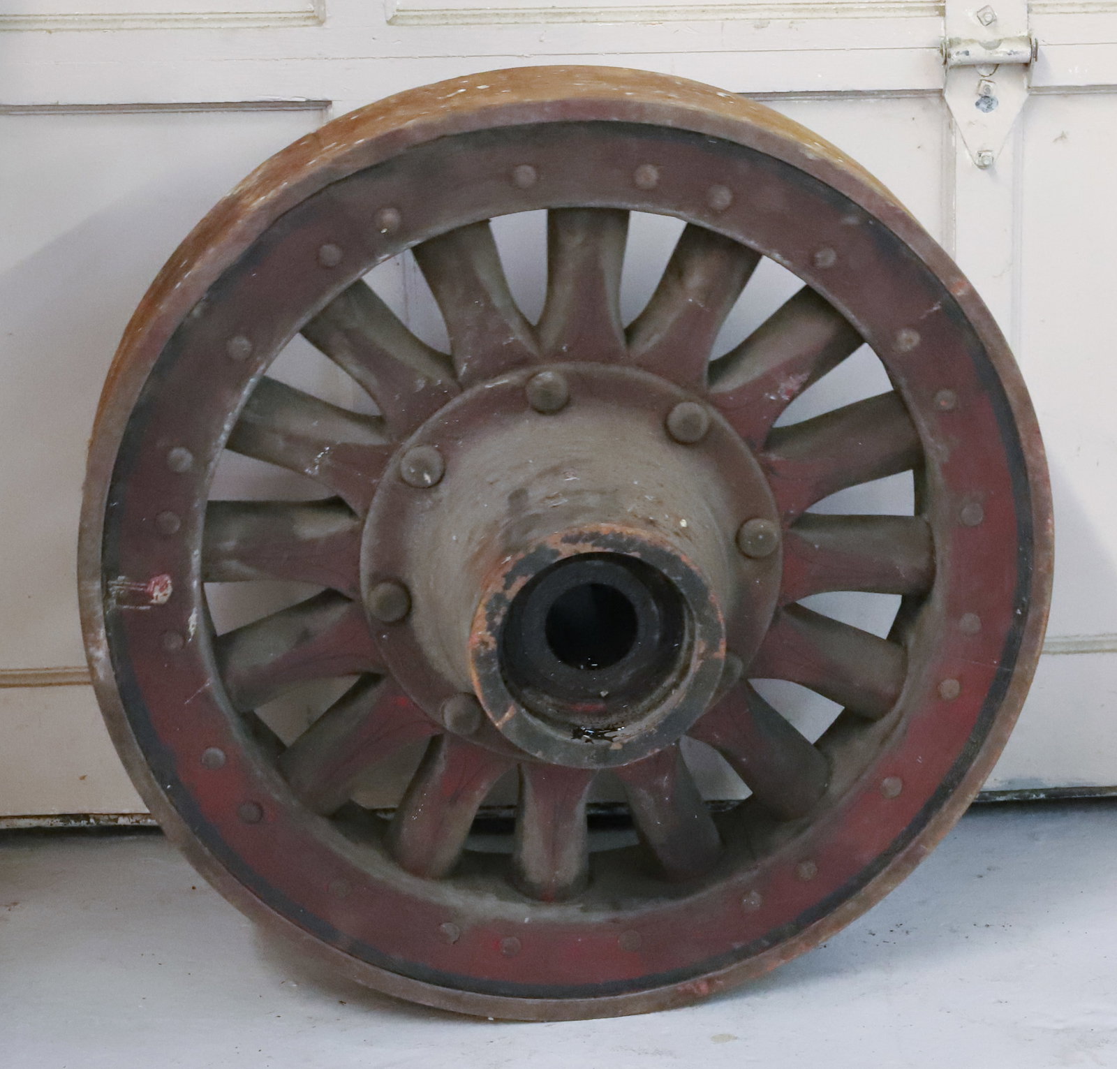 ANTIQUE INDUSTRIAL WHEEL: IRON AND PAINTED WOOD. 28" X 5". DUE TO WEIGHT AND SIZE CAN NOT BE SHIPPED. WINNING BIDDER IS RESPONSIBLE FOR PICK-UP IN 18013 OR ARRANGING SHIPPING. PLEASE READ CAREFULLY - Terms for Purchasing and S