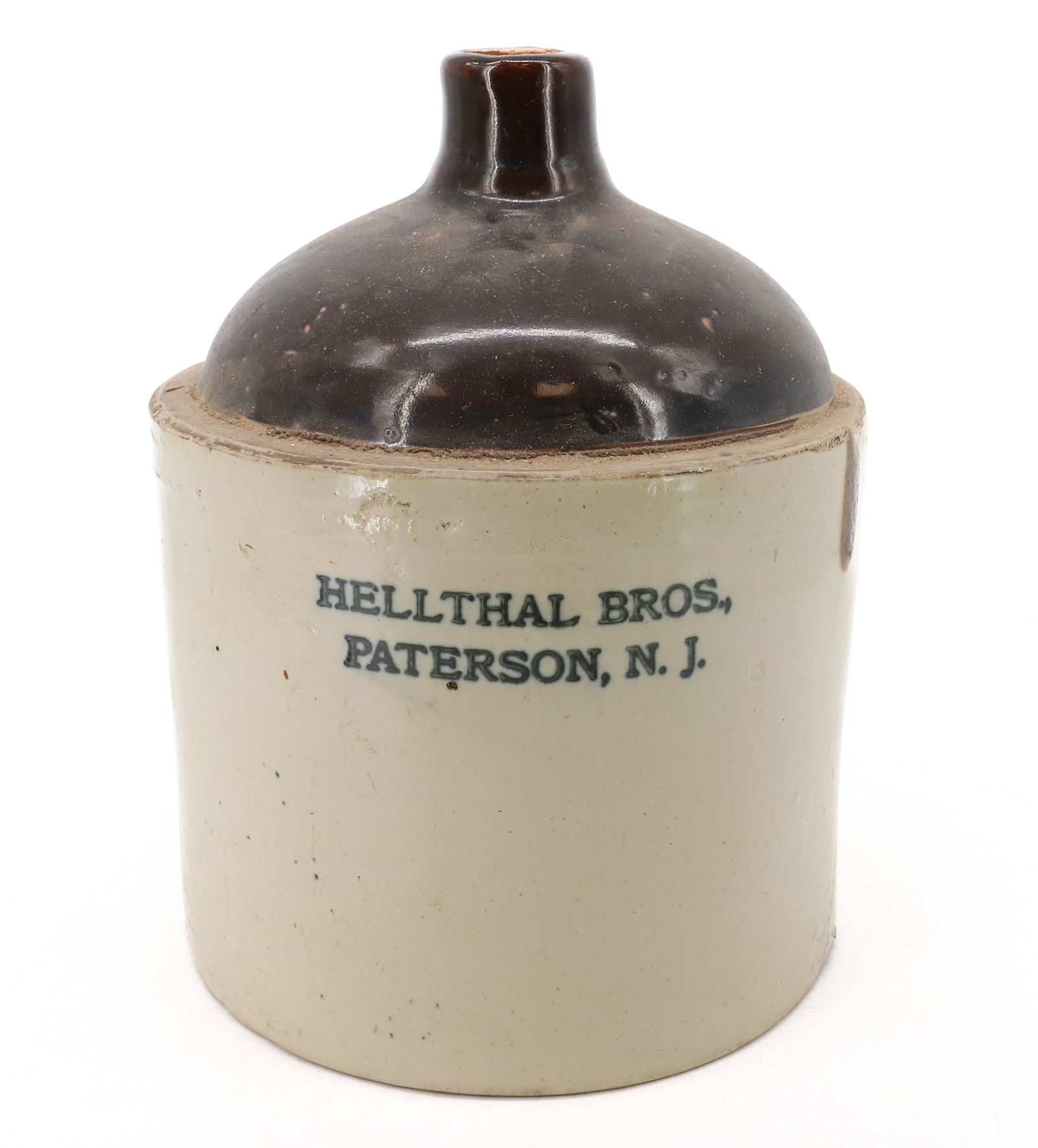 HELLTHAL BROS. STONEWARE ADVERTISING JUG: PATERSON, NJ. 12 1/2" H. PLEASE READ CAREFULLY - Terms for Purchasing and Shipping of Auction Items. Please read carefully before bidding. Hartzell’s Auction Gallery. Hartzell's Auction Gallery