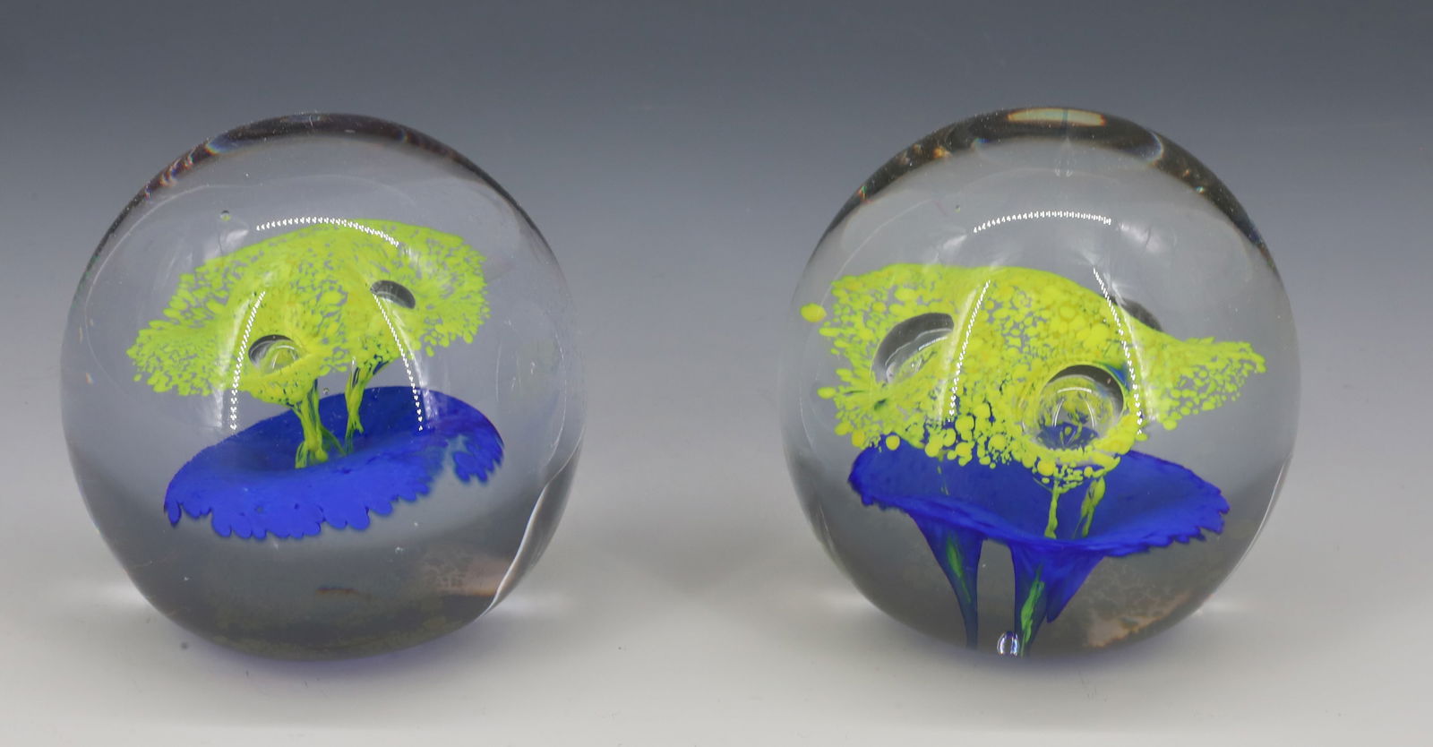 (2) SWEDISH ART GLASS PAPERWEIGHTS: BOTH SIMILAR IN STYLE. ONE HAS "MADE IN SWEDEN" LABEL. 2 3/4" H. PLEASE READ CAREFULLY - Terms for Purchasing and Shipping of Auction Items. Please read carefully before bidding. Hartzell’s Auct