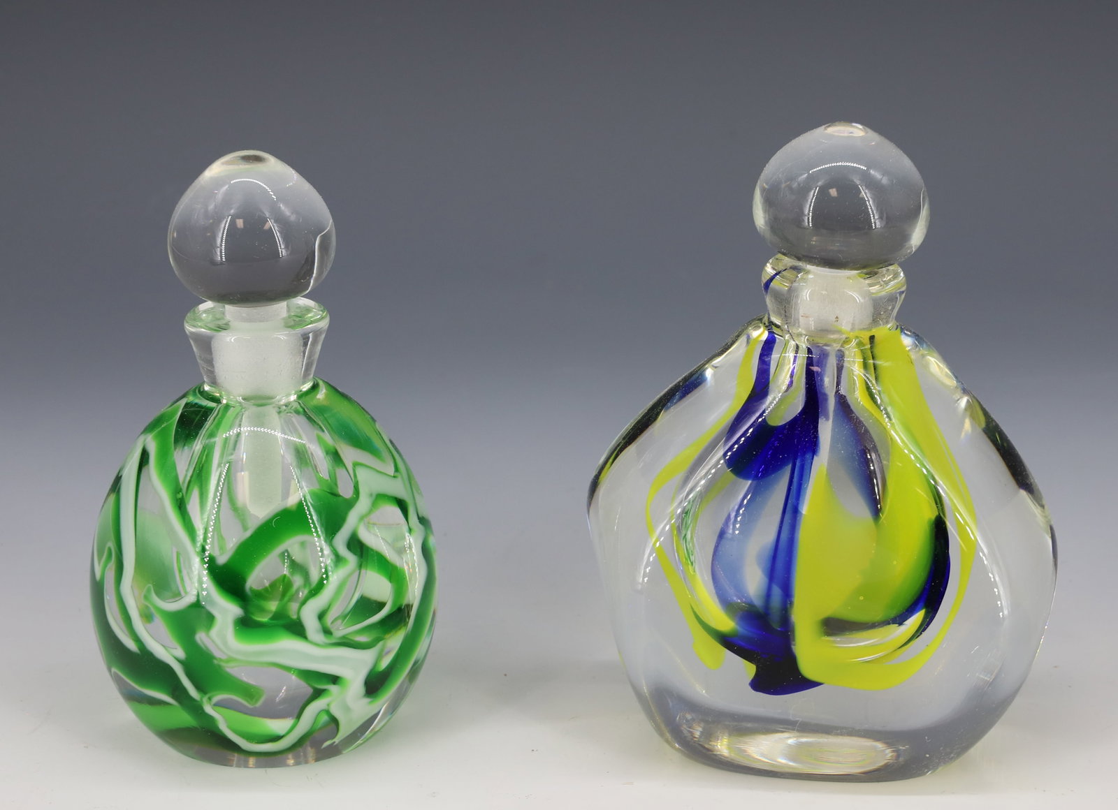 (2) ART GLASS PERFUME BOTTLES: BOTH BY RICHARD OLMA, 1989 CHICAGO AND 1990. LARGEST 5" H. PLEASE READ CAREFULLY - Terms for Purchasing and Shipping of Auction Items. Please read carefully before bidding. Hartzell’s Auction Ga