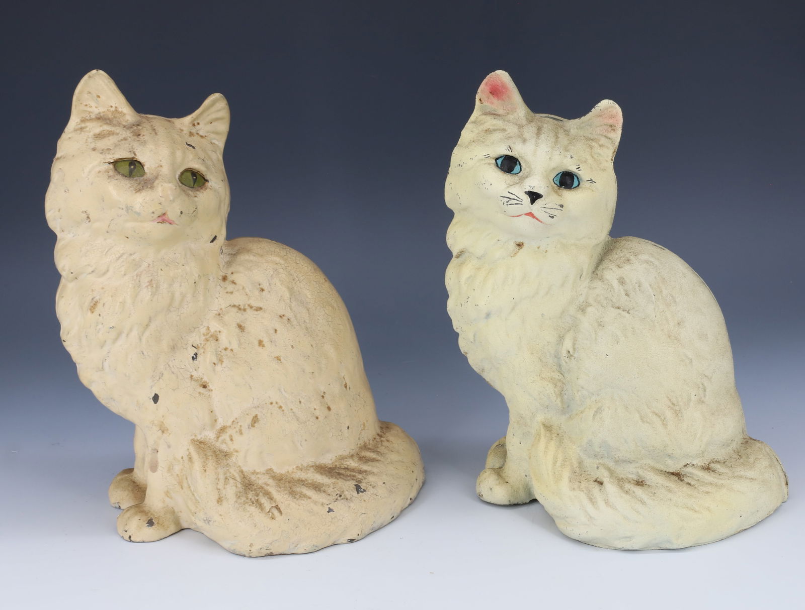 PAIR OF CAST IRON CAT DOORSTOPS: HOLLOW-BODY TWO-PART CONSTRUCTION. PROBABLY HUBLEY. 8 1/2" AND 9" HEIGHTS. PLEASE READ CAREFULLY - Terms for Purchasing and Shipping of Auction Items. Please read carefully before bidding. Hartzell