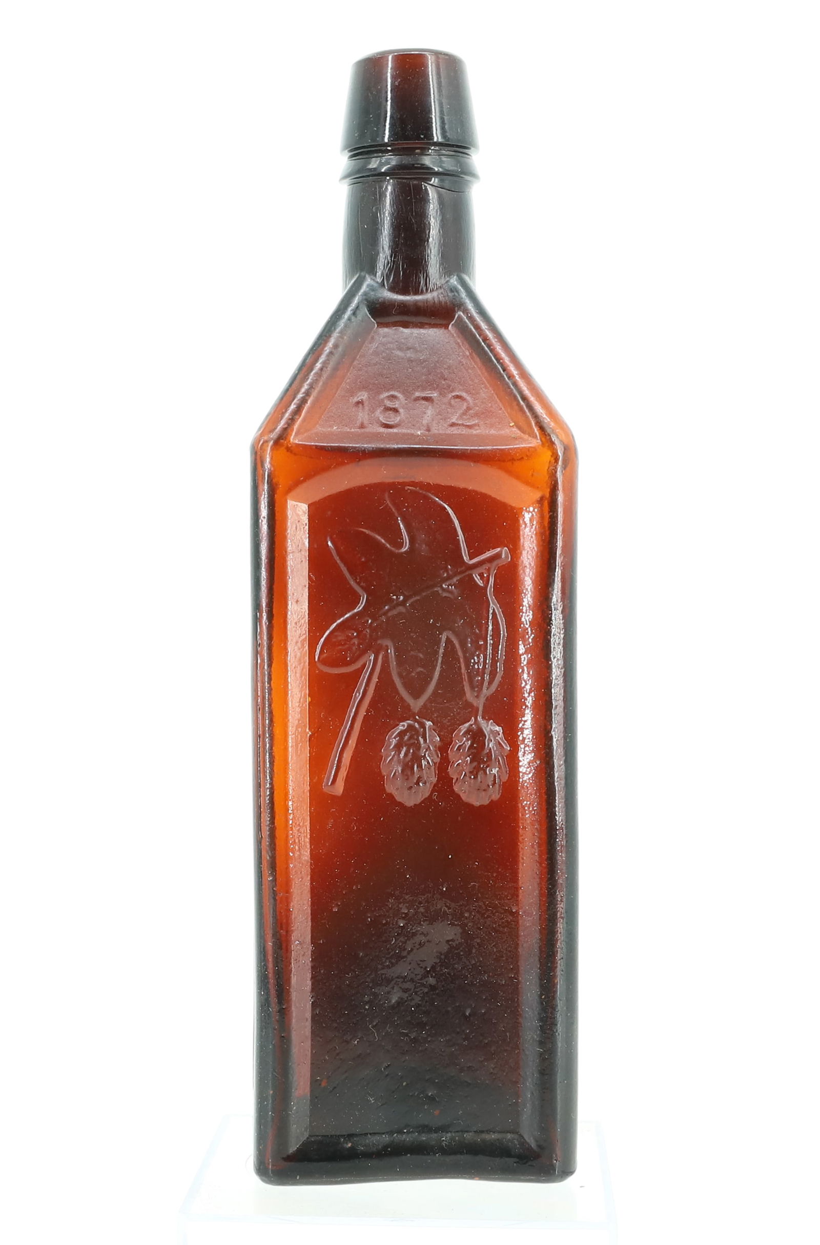 DOYLES HOP BITTERS BOTTLE: AMBER BOTTLE WITH EMBOSSED DECORATION. "1872". 9 1/4" H. PLEASE READ CAREFULLY - Terms for Purchasing and Shipping of Auction Items. Please read carefully before bidding. Hartzell’s Auction Gall
