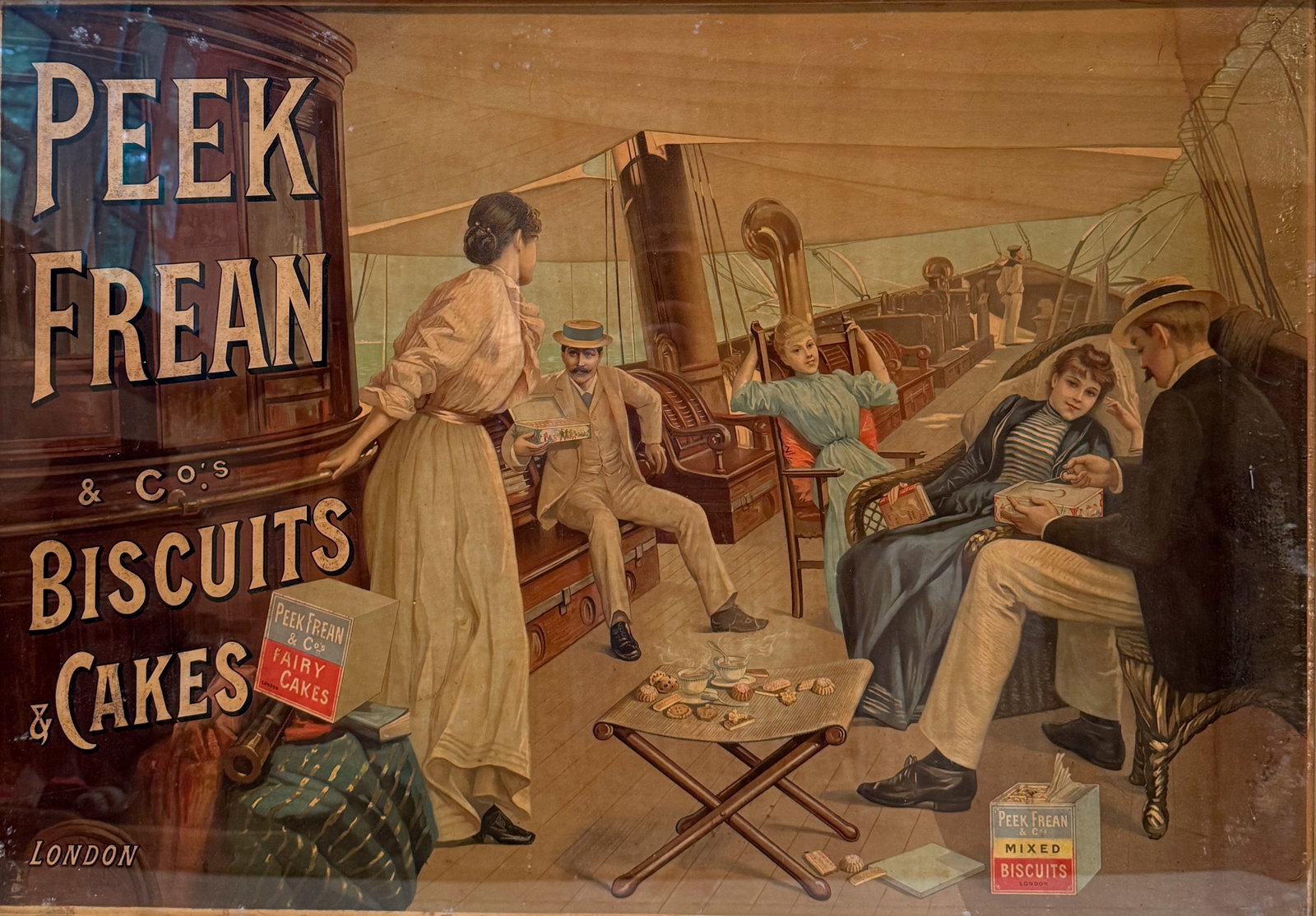 PEEK, FREAN & CO. ADVERTISING SIGN: "BISCUITS AND CAKES, LONDON". PAPER LITHO FRAMED UNDER GLASS. TOTAL SIZE 25 1/2" X 37". PLEASE READ CAREFULLY - THIS IS AN ONLINE ONSITE ONLY AUCTION - Terms for Purchasing and Shipping of Auction Ite