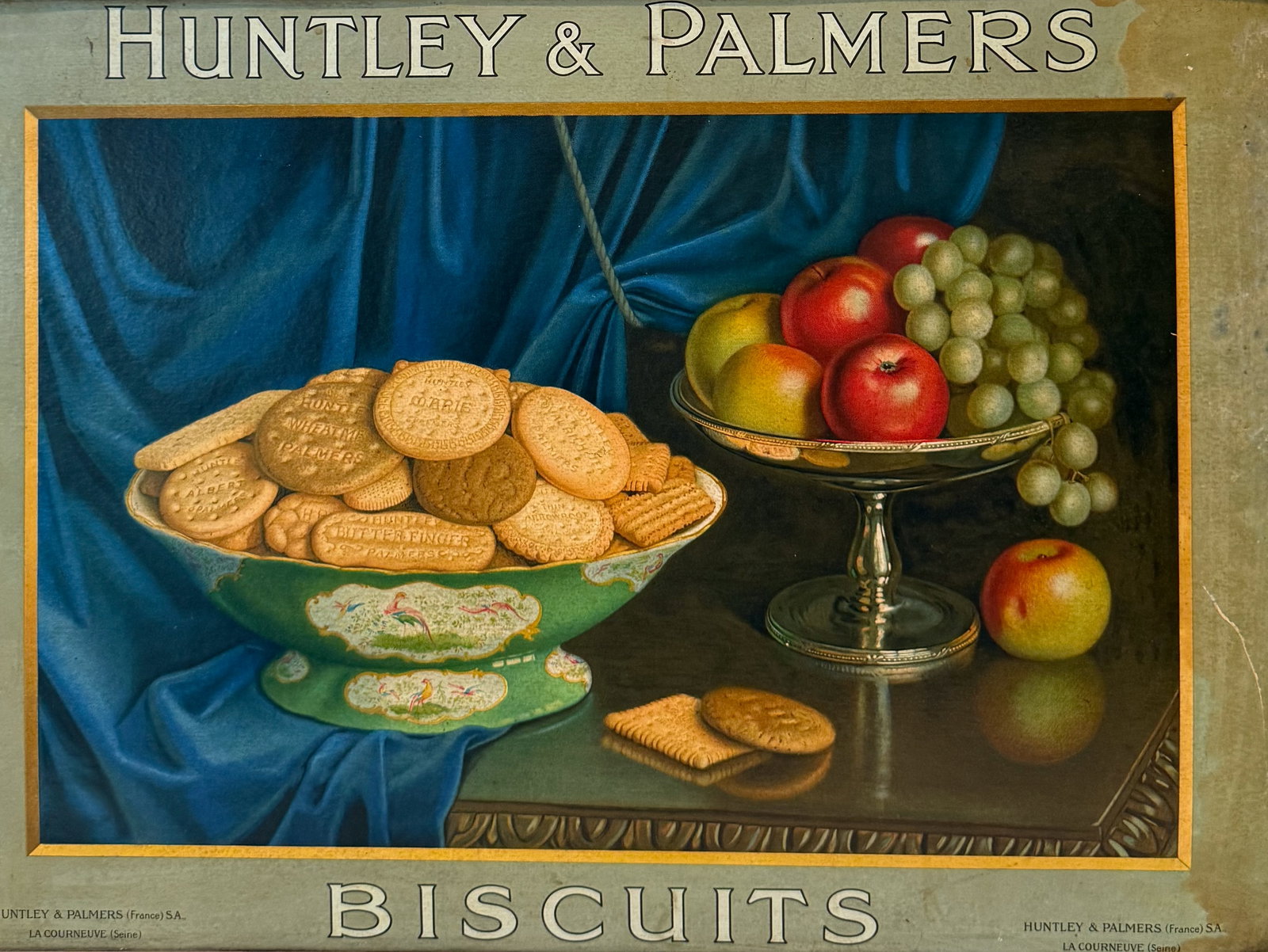 HUNTLEY & PALMERS ADVERTISING SIGN: "BISCUITS" STILL-LIFE OF FRUIT AND BISCUITS ON TABLE. ATTACHED PLACARDS ON FRAME "BISCUITS" AND "HUNTLEY PALMERS" MRKD. HUNTLEY & PALMERS (FRANCE). FRAMED SIZE (NO GLASS) 22" X 29". PLEASE READ CAREFU