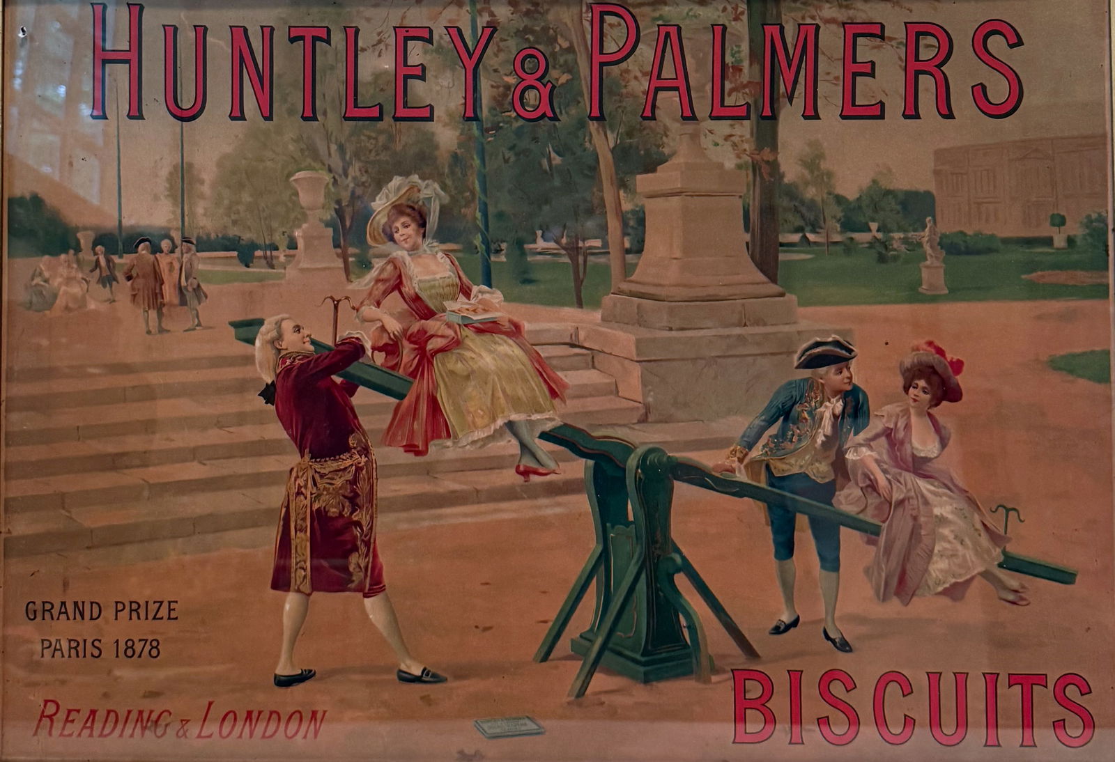 HUNTLEY & PALMERS ADVERTISING SIGN: "BISCUITS" DEPICTS COURTESANS ON SEE-SAW. "GRAND PRIZE, PARIS 1878, READING & LONDON". FRAMED UNDER GLASS. TOTAL SIZE 21 1/2" X 29". PLEASE READ CAREFULLY - THIS IS AN ONLINE ONSITE ONLY AUCTION - Ter