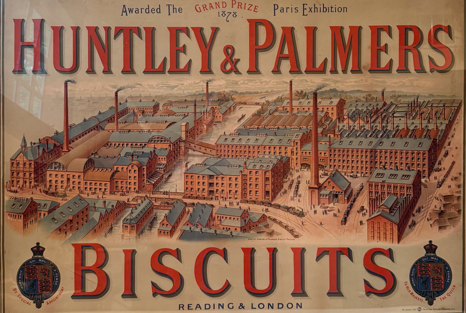 HUNTLEY & PALMERS ADVERTISING SIGN: "BISCUITS, READING & LONDON, AWARDED THE GRAND PRIZE PARIS EXHIBITION, 1878" FRAMED UNDER GLASS. TOTAL SIZE 29" X 39 1/2". PLEASE READ CAREFULLY - THIS IS AN ONLINE ONSITE ONLY AUCTION - Terms for Pur