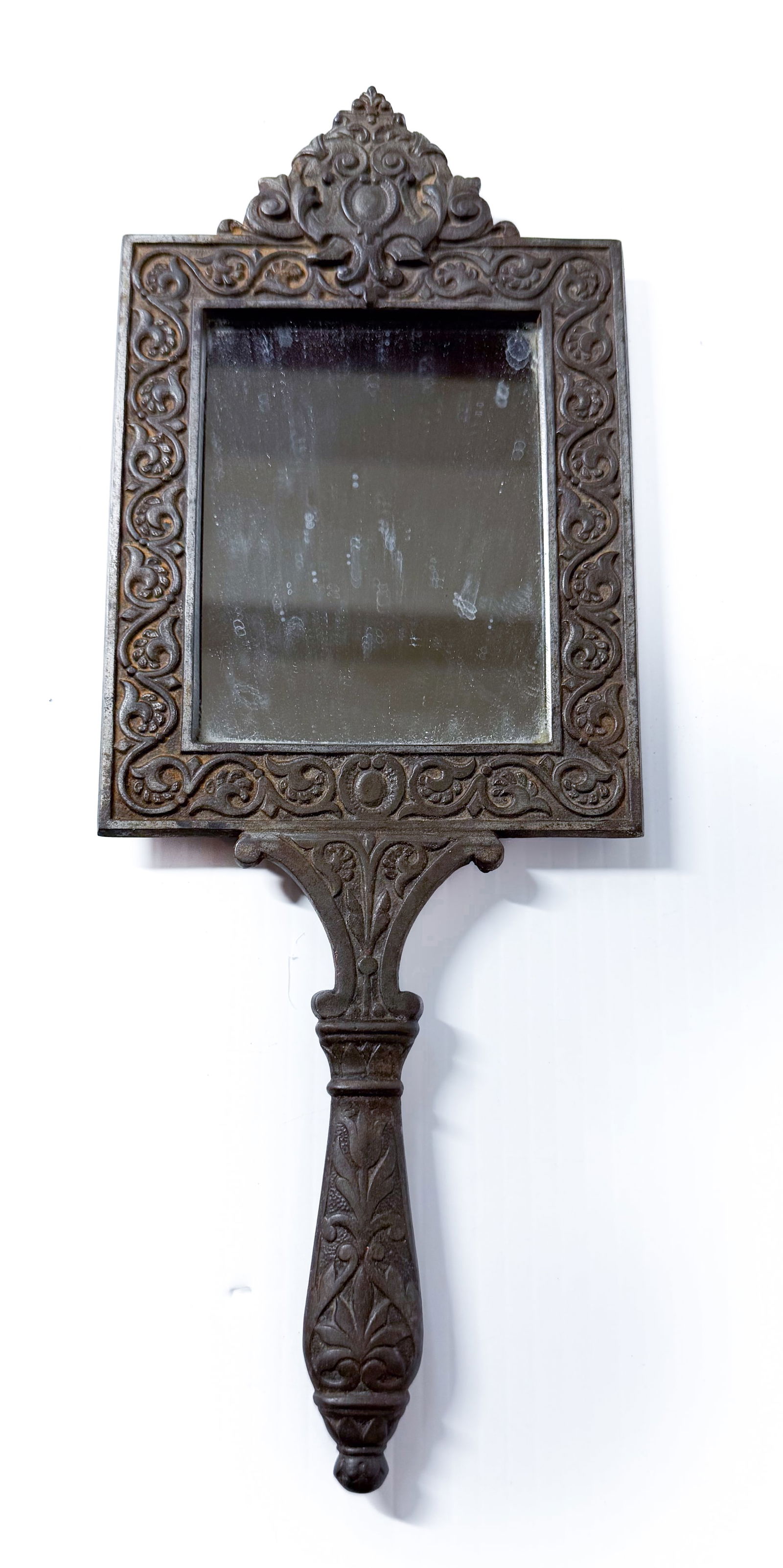 CAST IRON HAND MIRROR: VICTORIAN HAND MIRROR WITH DECORATED HANDLE / FRAME. 12" L. PLEASE READ CAREFULLY - THIS IS AN ONLINE ONSITE ONLY AUCTION - Terms for Purchasing and Shipping of Auction Items. Please read carefully be