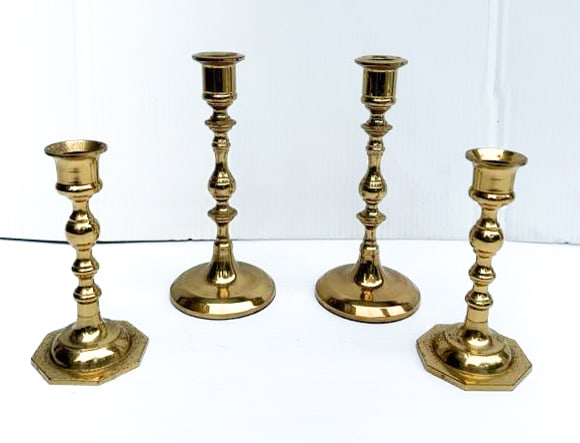 LOT OF BRASS CANDLESTICKS: TWO MATCHING PAIRS. SMALLER MRKD. TAIWAN ON BASES. 5 1/2" AND 7 1/4" HEIGHTS. PLEASE READ CAREFULLY - THIS IS AN ONLINE ONSITE ONLY AUCTION - Terms for Purchasing and Shipping of Auction Items. Please