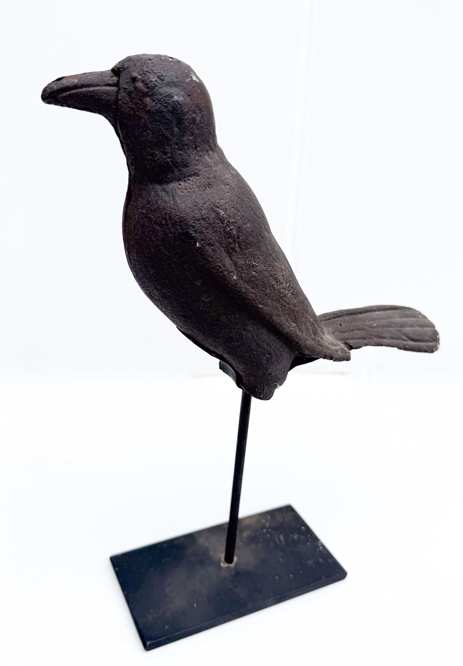 CAST IRON CROW ON STAND: CAST TWO-PIECE CROW ON MODERN DISPLAY STAND. 10 1/2" L. PLEASE READ CAREFULLY - THIS IS AN ONLINE ONSITE ONLY AUCTION - Terms for Purchasing and Shipping of Auction Items. Please read carefully before