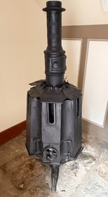 ANTIQUE CAST IRON REVOLVING STOVE