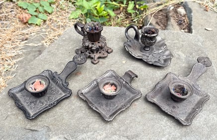 LOT OF CAST IRON CANDLEHOLDERS