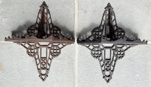 PAIR OF CAST IRON WALL SHELVES