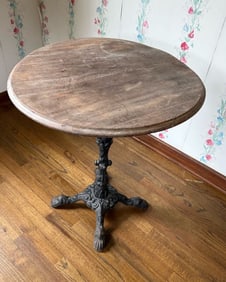 ANTIQUE ROUND TABLE WITH CAST IRON BASE