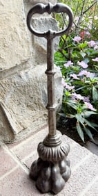 CAST IRON PAW FOOT DOOR STOP