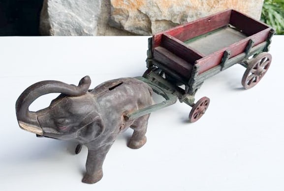 CAST IRON ELEPHANT PULLING WAGON (1 of 7)