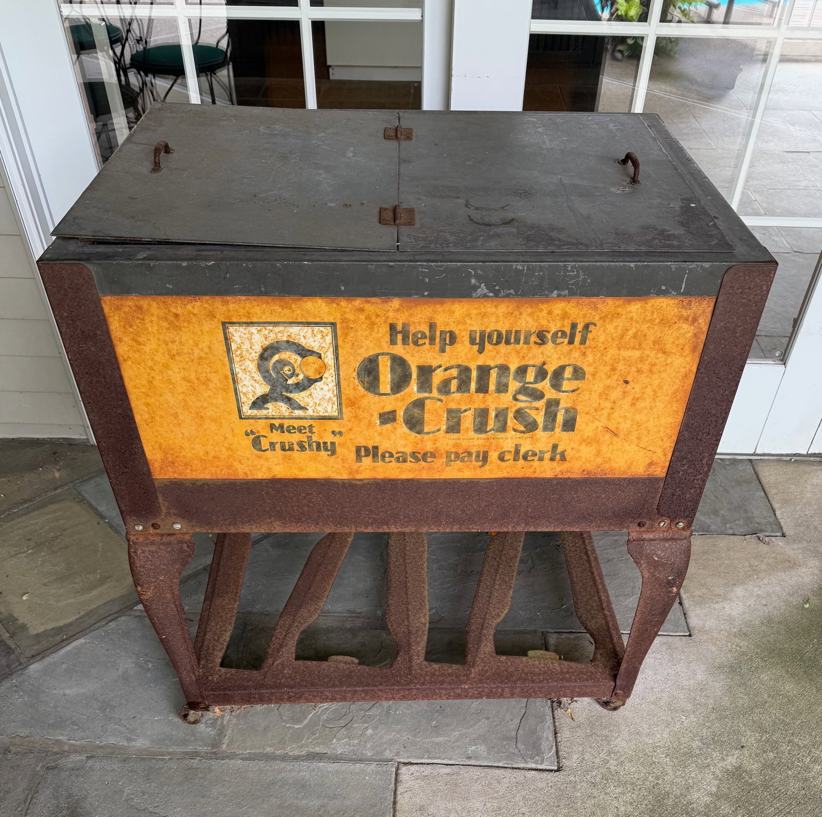 ORANGE CRUSH ADV. COOLER: DOUBLE HINGED LID, GALVANIZED INTERIOR - "HELP YOURSELF ORANGE CRUSH" - 33 1/12" X 31" X 22" CONDITION REPORTS ARE BASED ON VISUAL INSPECTION. IF YOU HAVE ANY FURTHER QUESTIONS REGARDING CONDITION OF 