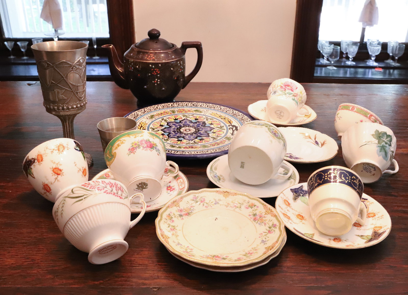 VARIOUS CUPS /SAUCERS, PEWTER AND MORE: VARIOUS FLORAL ENGLISH BONE CHINA CUP / SAUCERS, JAPANESE TEAPOT, PEWTER CHALICE DATED "1998" 7 3/8". PLEASE READ CAREFULLY - THIS IS AN ONLINE ONLY AUCTION - Terms for Purchasing and Shipping of Auct