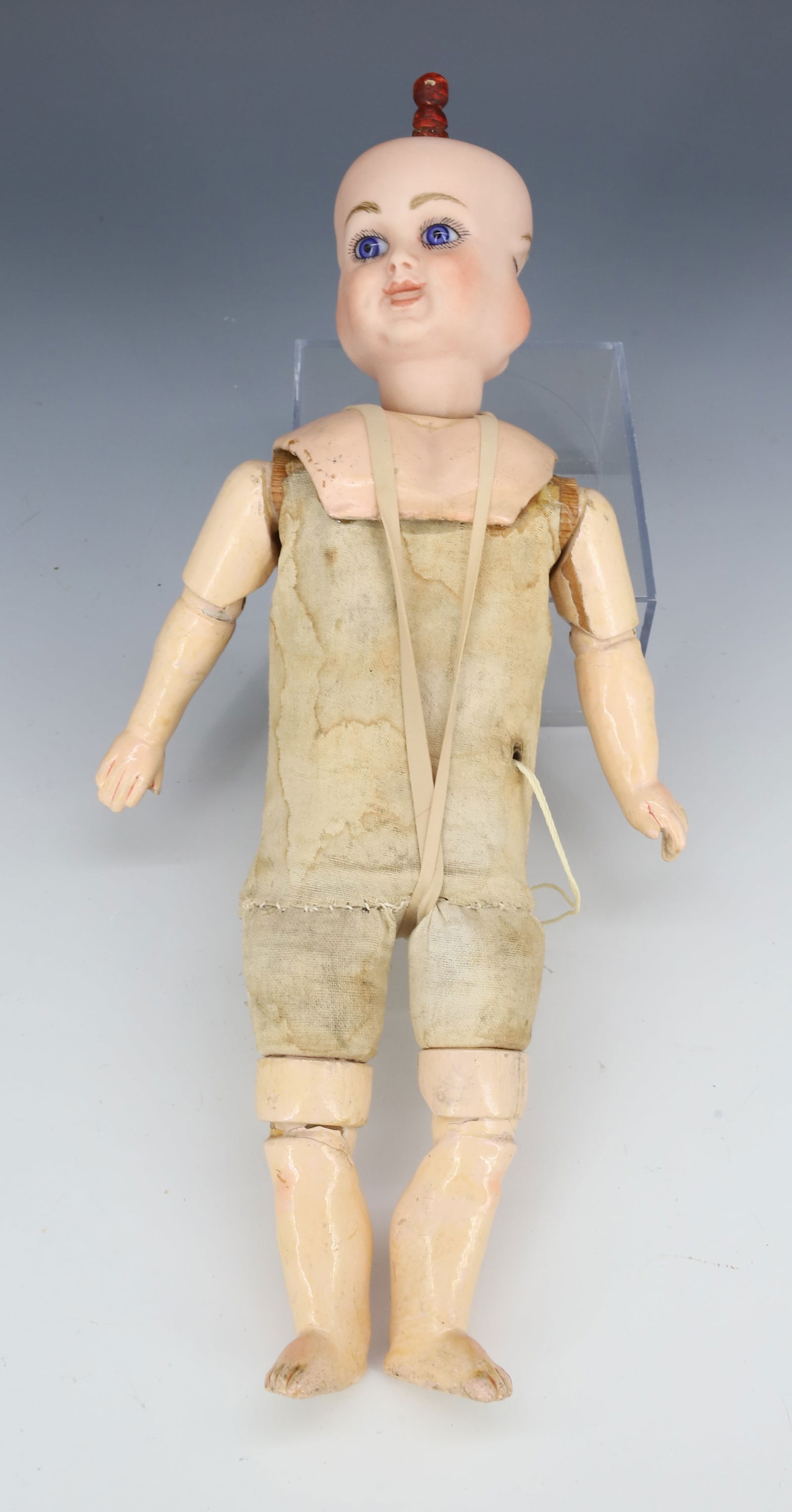 ANTIQUE THREE-FACED BISQUE DOLL: HANDPAINTED BISQUE HEAD WITH GLASS EYES. COMPOSITION SHOULDERS AND LIMBS, CLOTH BODY. 10 3/4" L. PLEASE READ CAREFULLY - Terms for Purchasing and Shipping of Auction Items. Please read carefully befor