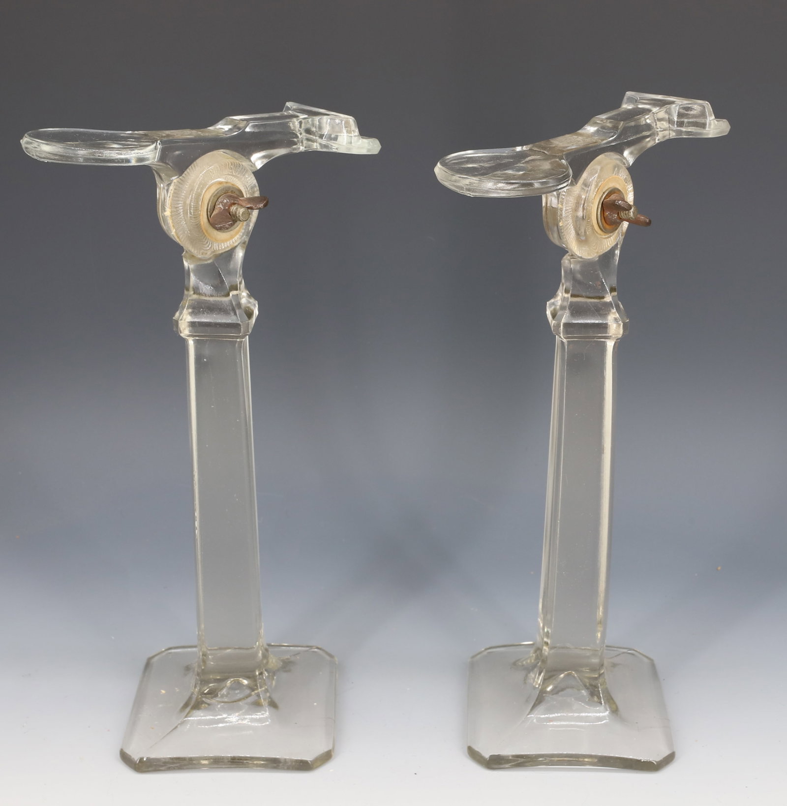 PAIR OF GLASS SHOE DISPLAYS: ADJUSTABLE PEDESTAL DISPLAYS. MRKD. ON TOP. 11" H. PLEASE READ CAREFULLY - Terms for Purchasing and Shipping of Auction Items. Please read carefully before bidding. Hartzell?s Auction Gallery. Hartzel