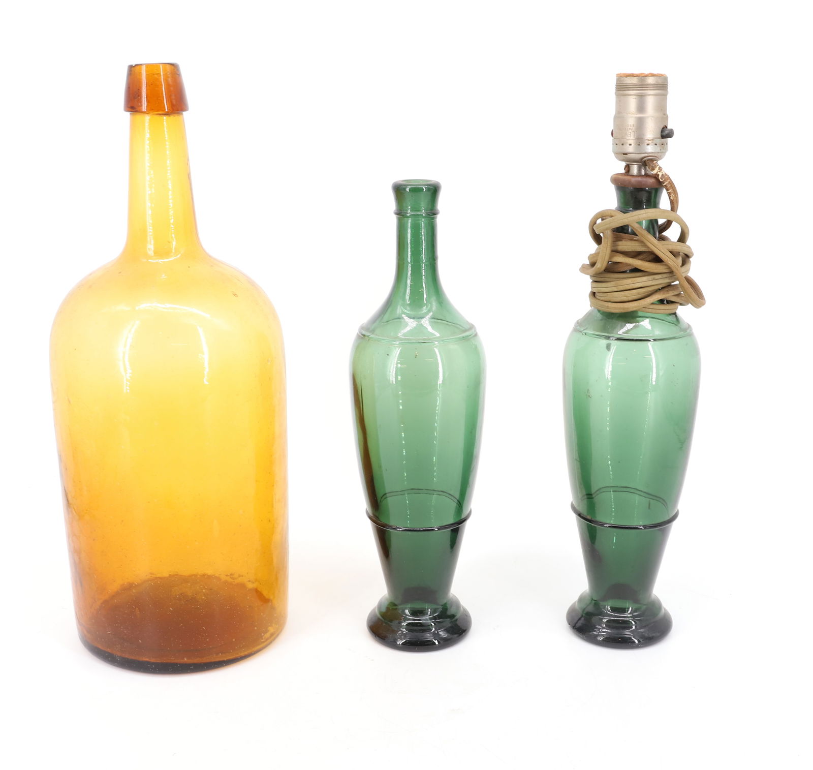 LOT OF VINTAGE BOTTLES: AMBER BOTTLE WITH APPLIED TOP 15" WITH TWO GREEN BOTTLES (ONE USED AS LAMP). PLEASE READ CAREFULLY - Terms for Purchasing and Shipping of Auction Items. Please read carefully before bidding. Hartzell?
