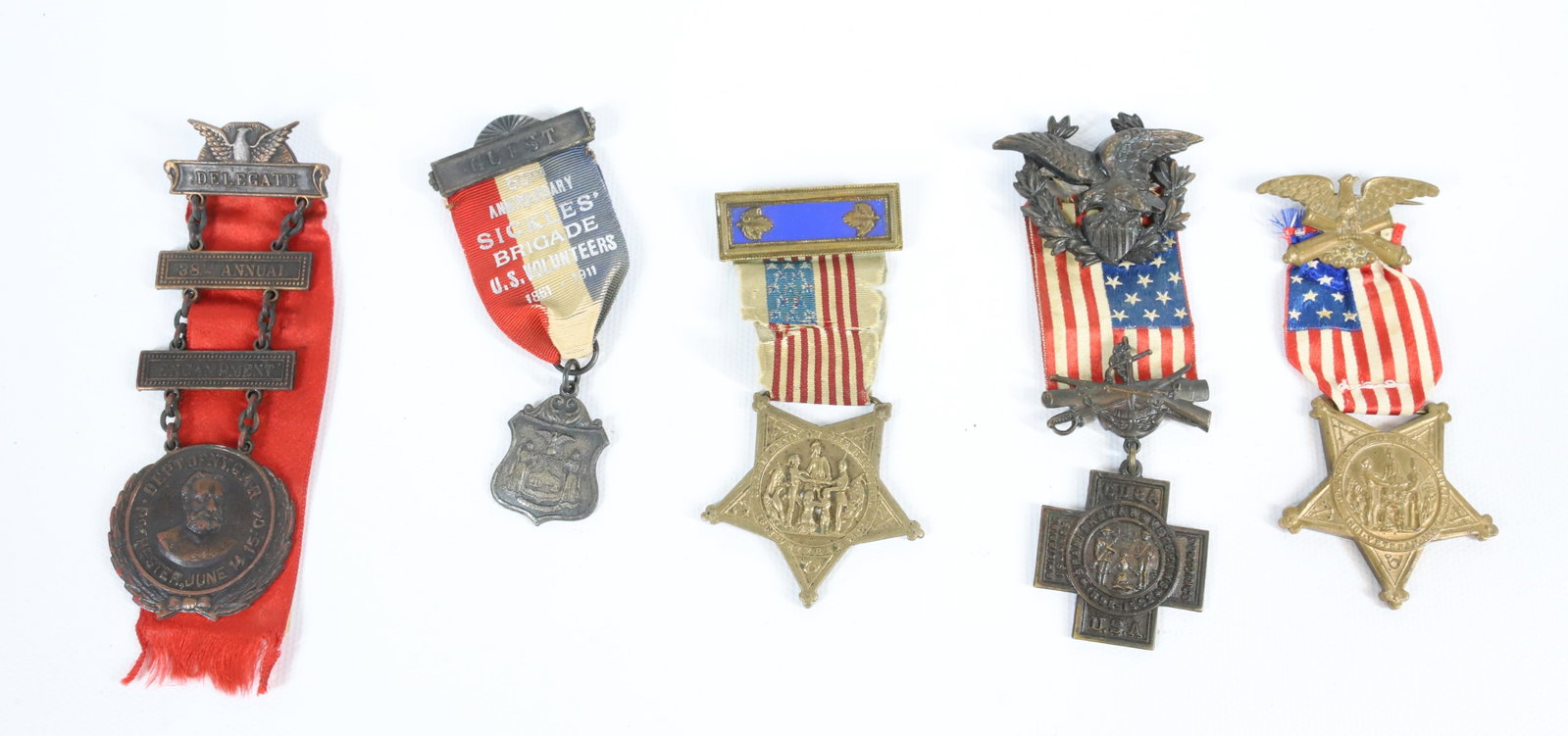LOT OF VETERAN MEDALS: (5) MEDALS INCLUDING; SICKLES BRIGADE VOLUNTEER BADGE, SPANISH AMERICAN WAR VETERANS BADGE, NEW YORK GRAND ARMY OF THE REPUBLIC, AND MORE PLEASE READ CAREFULLY BEFORE BIDDING. ALL PAYMENTS MUST BE MAD