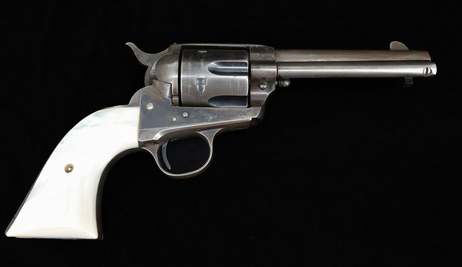 COLT SINGLE ACTION ARMY REVOLVER: 38-40 CAL, SERIAL# 328331, PEARL GRIPS, MARKED; WM. HEART ON BUTT, 4 3/4" BARREL, MFG. 1914 THIS GUN REQUIRES A BACKGROUND CHECK, FEDERAL FIREARMS LICENSE. OR TRANSFER TO AN FFL HOLDER PLEASE READ CAR