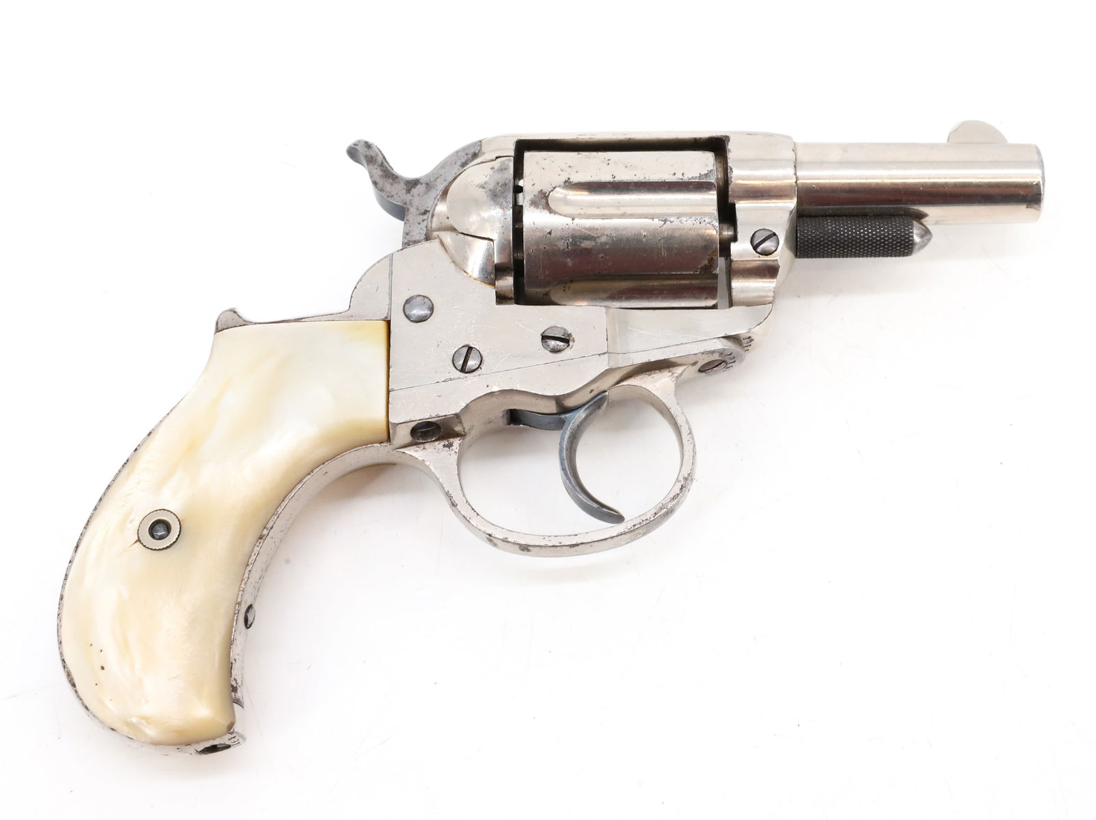 COLT MODEL 1877 DA REVOLVER: 38 CAL. SERIAL# 29150, 2 1/2" BARREL, IN NICKEL, WITH PEARL GRIPS ANTIQUE OR BLACK POWDER, NO REGISTRATION OR TRANSFER REQUIRED PLEASE READ CAREFULLY BEFORE BIDDING. ALL PAYMENTS MUST BE MADE BEFORE I