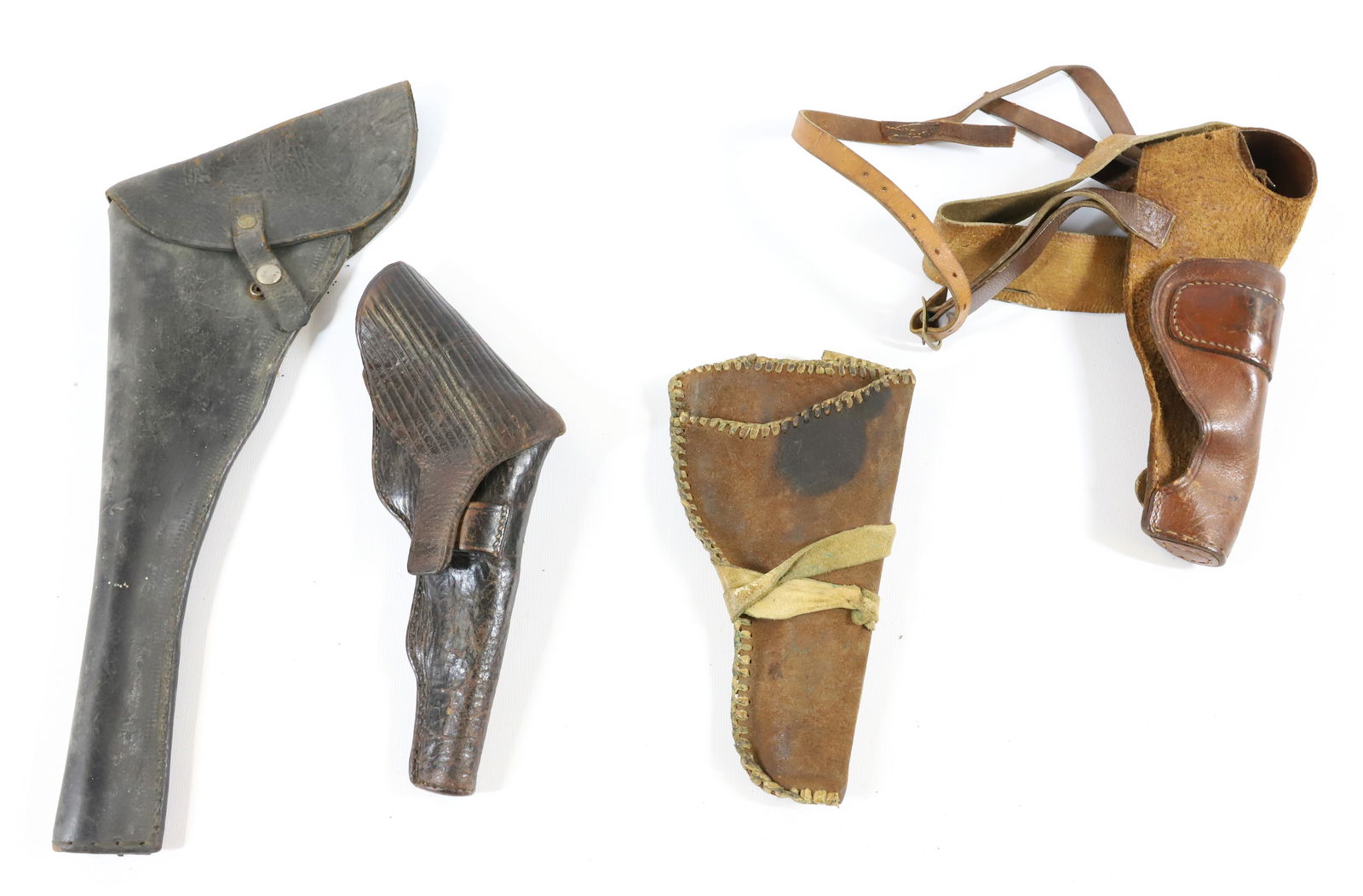 LOT OF LEATHER HOLSTERS: FOUR INCLUDING: SHOULDER HOLSTER AND BELT HOLSTER. ONE MRKD. REYES. LONGEST 14". - PICK-UP FOR THIS AUCTION WILL BE ON MONDAY NOVEMBER 3RD, TUESDAY NOVEMBER 4TH, WEDNESDAY NOVEMBER 5TH, AND THURSDAY N