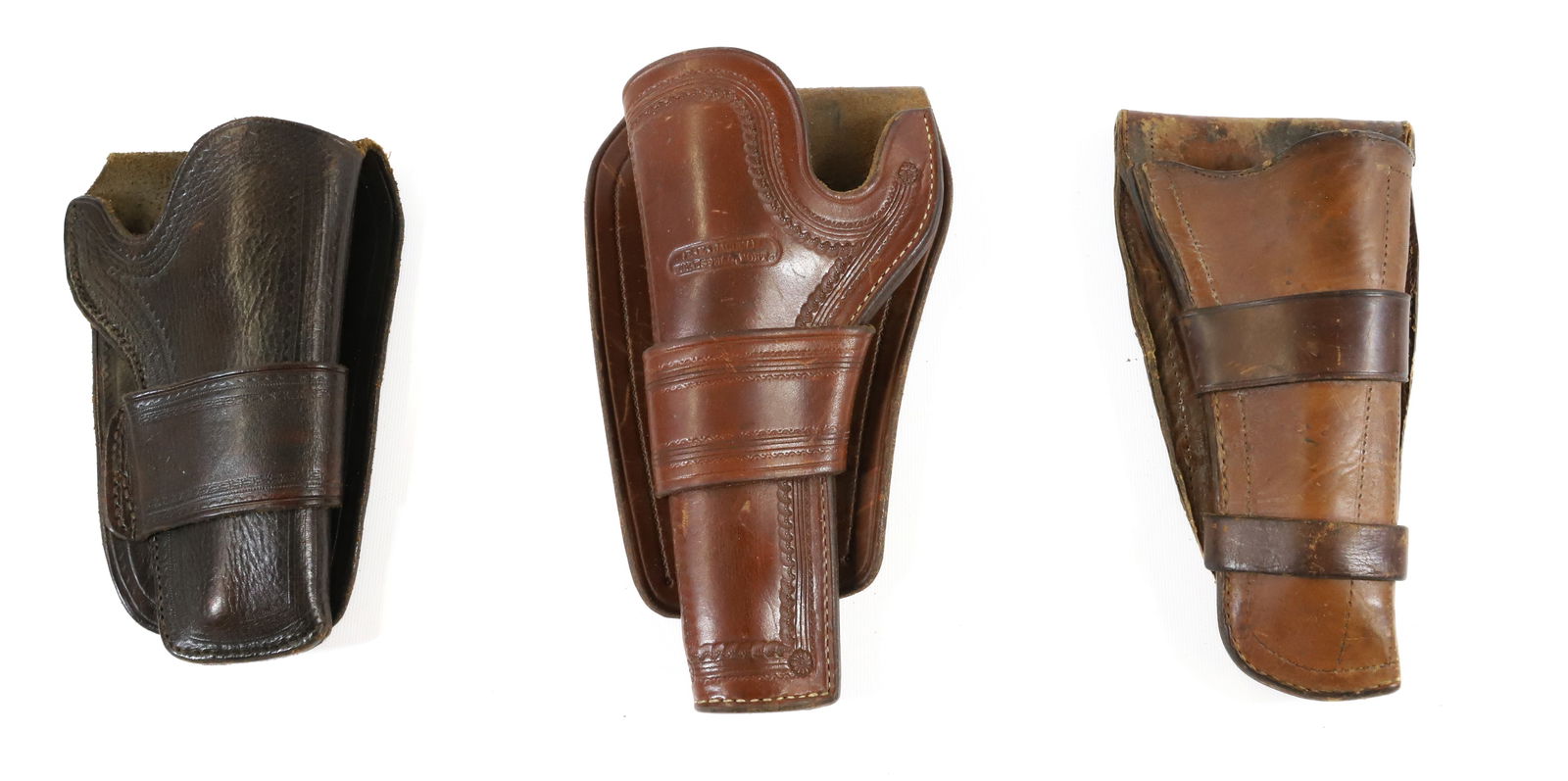 LOT OF (3) LEATHER HOLSTERS: INCLUDING: OLD WESTERN, R.M. BACHMAN AND OTHER. 7 1/2, 8" AND 9" LENGTHS. - PICK-UP FOR THIS AUCTION WILL BE ON MONDAY NOVEMBER 3RD, TUESDAY NOVEMBER 4TH, WEDNESDAY NOVEMBER 5TH, AND THURSDAY NOVEMBER