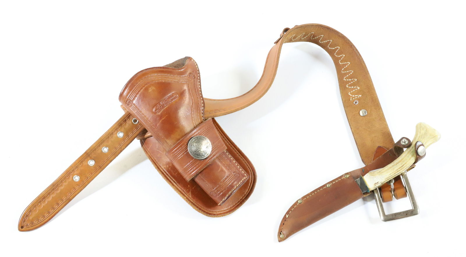 LEATHER HOLSTER WITH BELT / KNIFE: R.M. BACHMAN, MONTANA MAKER. LEATHER BELT WITH HOLSTER AND KNIFE. BELT IS 33" L. WITH GOLD HEART EMBELLISHMENT. - PICK-UP FOR THIS AUCTION WILL BE ON MONDAY NOVEMBER 3RD, TUESDAY NOVEMBER 4TH, WEDNESD