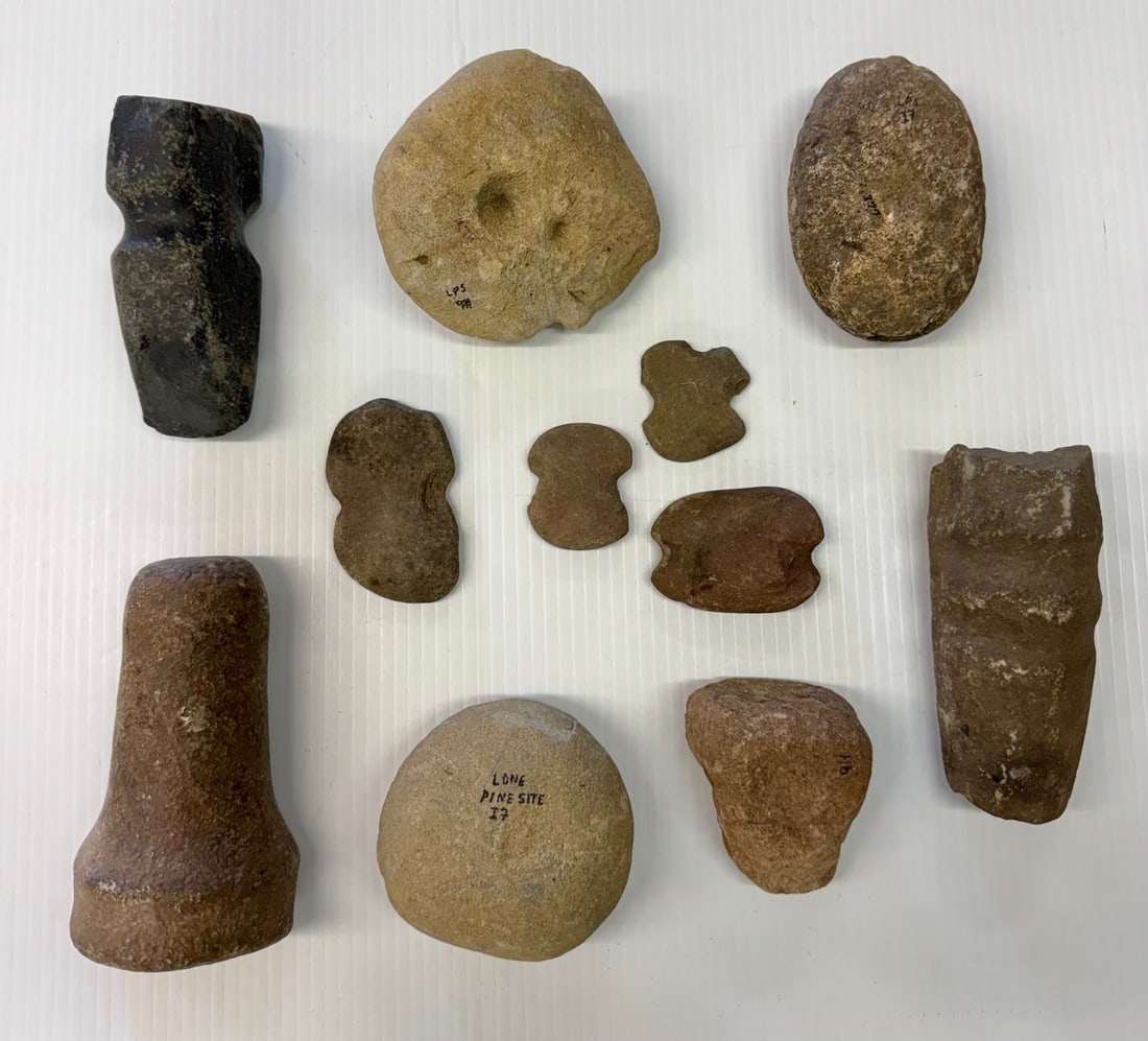 LOT OF CARVED STONE ARTIFACTS: VARIOUS SIZE AND SHAPES. MRKD. "LONE PINE SITE" AND NUMBERED. LARGEST 5 3/4" L.