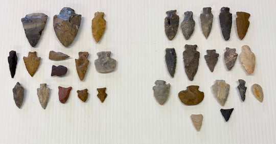 LOT OF (2) CASES OF CARVED STONE ARTIFACTS